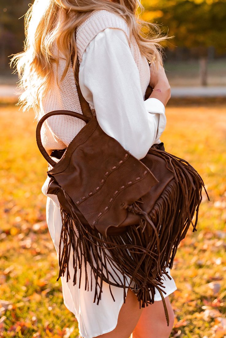 Very soft dark brown leather backpack with fringe. Authentic leather. Kobler is the designer. Brown Fringe Bag For Fall, Fringe Bags For Everyday Use In Fall, Everyday Fringe Bags For Fall, Everyday Fringe Bag For Fall, Fall Leather Standard Backpack, Leather Backpack For Fall, Travel Hobo Bag With Fringe In Brown, Leather Shoulder Bag With Tassels For Fall, Fall Leather Shoulder Bag With Fringe