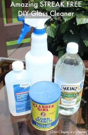 several cleaning products sitting on top of a glass table