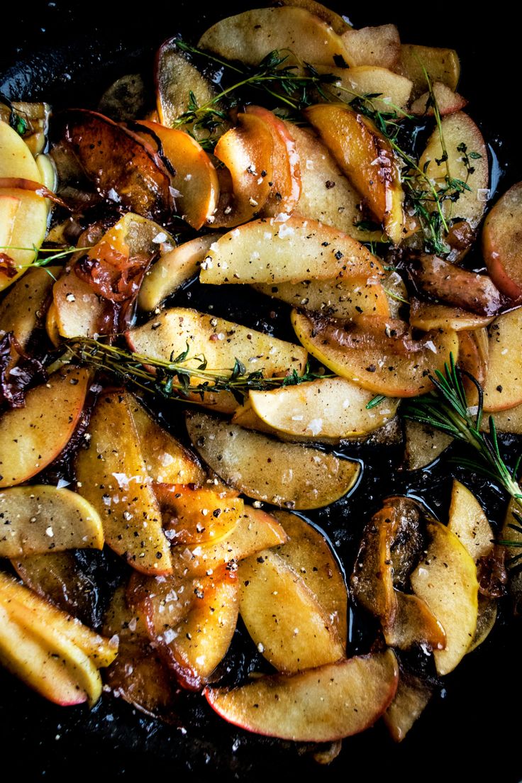 cooked potatoes with herbs and seasoning in a skillet