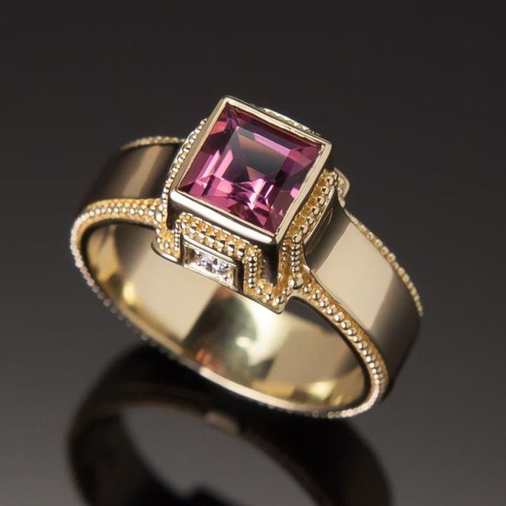 This exquisite Pink Tourmaline & Diamond Classical Ring features a stunning pink tourmaline set in luxurious granulated 18K gold and is finished with two sparkling diamonds gracefully adorning its sides. Perfect for adding a touch of luxury to any look. 18KY granulated ring with a square cut 1.11ct pink tourmaline and 0.065cttw VS/G-H diamonds. Size 7, but each ring comes with free sizing and FREE SHIPPING! Unsure what ring size you are? It's always best to be sized by a professional jeweler, bu Elegant Tourmaline Gemstone Diamond Ring, Elegant Tourmaline Diamond Ring, Luxury Tourmaline Rings, Elegant Gold Tourmaline Rings, Luxury Pink Sapphire Ring For Formal Occasions, Luxury Tourmaline Jewelry For Formal Occasions, Formal Pink Sapphire Ring With Pave Setting, Luxury Pink Sapphire Ring With Accent Stones, Luxury Pink Sapphire Rings With Single Cut Diamonds