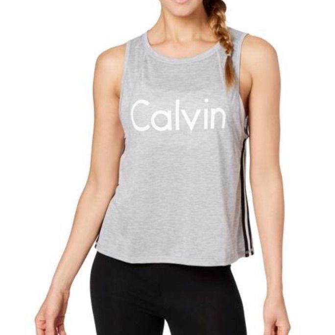 Cropped Tank From Calvin Klein Performance With Racer-Stripe. Dropped Armholes, Cropped Shape, Hits Above Waist, Drop Arm Openings, Stripes At Sides; Polyester/Rayon Machine Washable Striped Athleisure Tops For Sports, Cotton Workout Tops With Three Stripes, Spring Striped Sports Tops, Fitted Calvin Klein Athleisure Tops, Striped Athleisure Tops, Sporty Striped Tank Top For Spring, Casual Stretch Calvin Klein Tank Top, Relaxed Fit Tops With Three Stripes For Spring, Sporty Striped Sleeveless Top