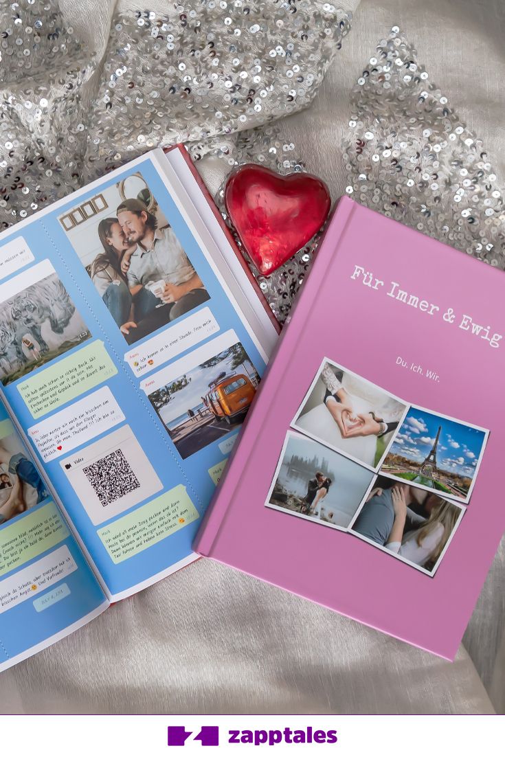 an open book with pictures on it next to a heart - shaped object and silver sequins