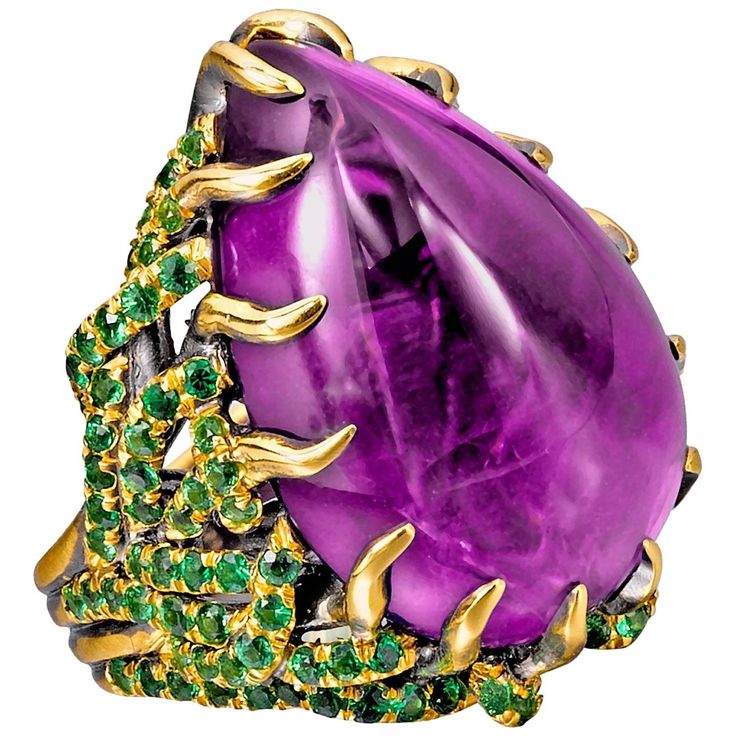 This gorgeous ring, inspired by the true story of Marie Antoinette, was created in New York City by our expert goldsmith. Creating this labor-intensive piece took over one month, with each pavé tsavorite being set by hand by a gem setter who has truly mastered his craft. The combination of purple amethyst and green garnet is a symbol of royalty; royal women are the inspiration for many of Wendy's designs. The creeping, thorn-like prongs convey the way Marie Antoinette was drawn into a frightenin Purple Combination, Amethyst Cocktail Ring, Yellow Gold Cocktail Ring, Amethyst Birthstone, Green Garnet, Purple Reign, Gold Cocktail Ring, Contemporary Ring, Gold Cocktail