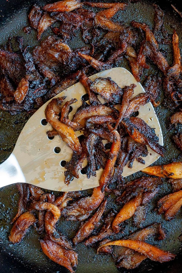 some food is cooking in a frying pan