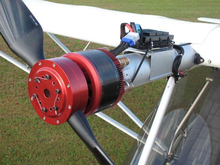 an airplane engine attached to the wing of a plane