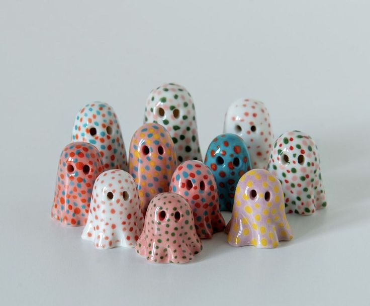 there are many different colored polka dots on the same object in this photo, and they appear to be made out of ceramic