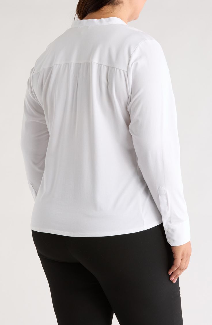 A mix of fabrics create subtle dimension on this bright-white top that brings a refined appearance to any ensemble. 28" length (size 1X) Split neck Long sleeves Front: 100% cotton; back: 57% cotton, 38% modal, 5% spandex Machine wash, tumble dry Imported White Fitted Blouse For Layering, White Office Top With Shirttail Hem, White Blouse For Workwear With Shirttail Hem, White Classic Fitted Top, Versatile White Tops With Shirttail Hem, Classic White Fitted Top, Versatile White Shirttail Hem Top, Fitted White Blouse With Shirttail Hem, White Fitted Blouse With Shirttail Hem