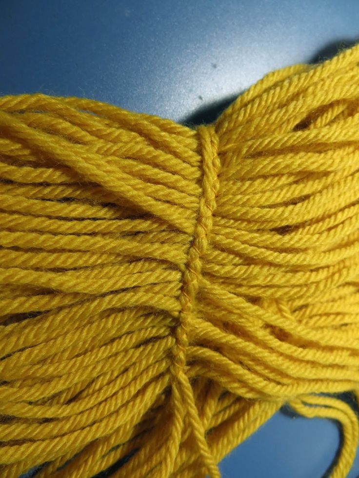 a yellow rope is on top of a table