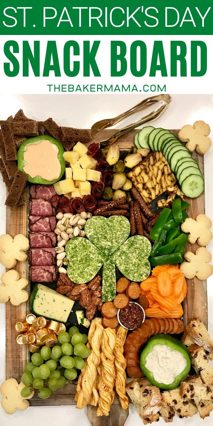 a wooden tray filled with lots of different types of food on top of each other