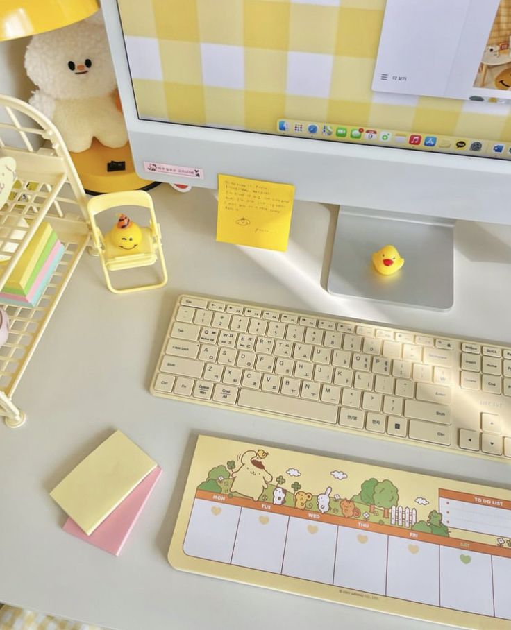 a desktop computer sitting on top of a desk next to a keyboard and mouse pad