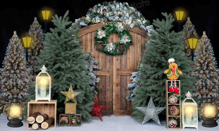 christmas decorations and lights are displayed in front of a wooden door, surrounded by fir trees