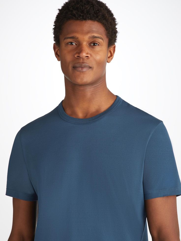 Designed in a fabric exclusive to Derek Rose, Barny is our brand new everyday wear t-shirt. Knitted in the EU, our mid weight Pima cotton t-shirt is not only breathable, but hypoallergenic. An excellent choice for any occasion. Created in a casual relaxed fit, the crew neckline features a bound collar with detailed ribbing. We have chosen to print our label inside of the neckline for optimal comfort. With twin needle cuffs and hem, our Barny t-shirt, seen here in denim blue, is made for every ad Relaxed Fit Pima Cotton Crew Neck Top, Pima Cotton Relaxed Fit Crew Neck Top, Relaxed Fit Crew Neck Top In Pima Cotton, Casual Short Sleeve Pima Cotton Top, Casual Pima Cotton Short Sleeve Top, Blue Organic Cotton Crew Neck T-shirt, Casual Crew Neck Pima Cotton Top, Casual Relaxed Fit Pima Cotton T-shirt, Casual Pima Cotton Crew Neck Top