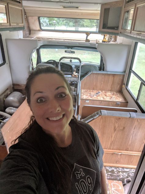 a woman is taking a selfie in an rv