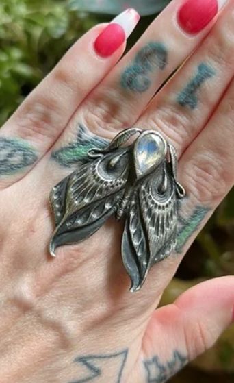 Bloodmilk: moth ring, sterling silver with moonstone (sold on Poshmark for US $307.97, 18 August 2023) Moth Wedding Ring, Moth Wedding, Silver Metal Witchy Jewelry, Luna Moth Jewelry, Moth Ring, Lunar Moth Necklace, Bug Ring, Moth Jewelry, Silver Moth Earrings