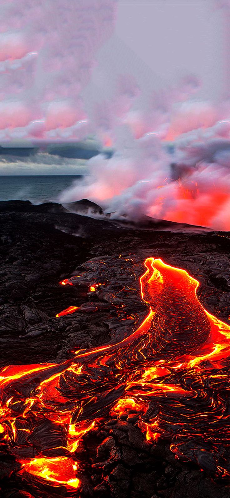 the lava is glowing red and orange as it moves through the air with clouds in the background