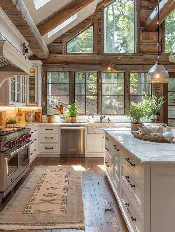 a kitchen with an oven, stove and sink inside of it on a wooden floor