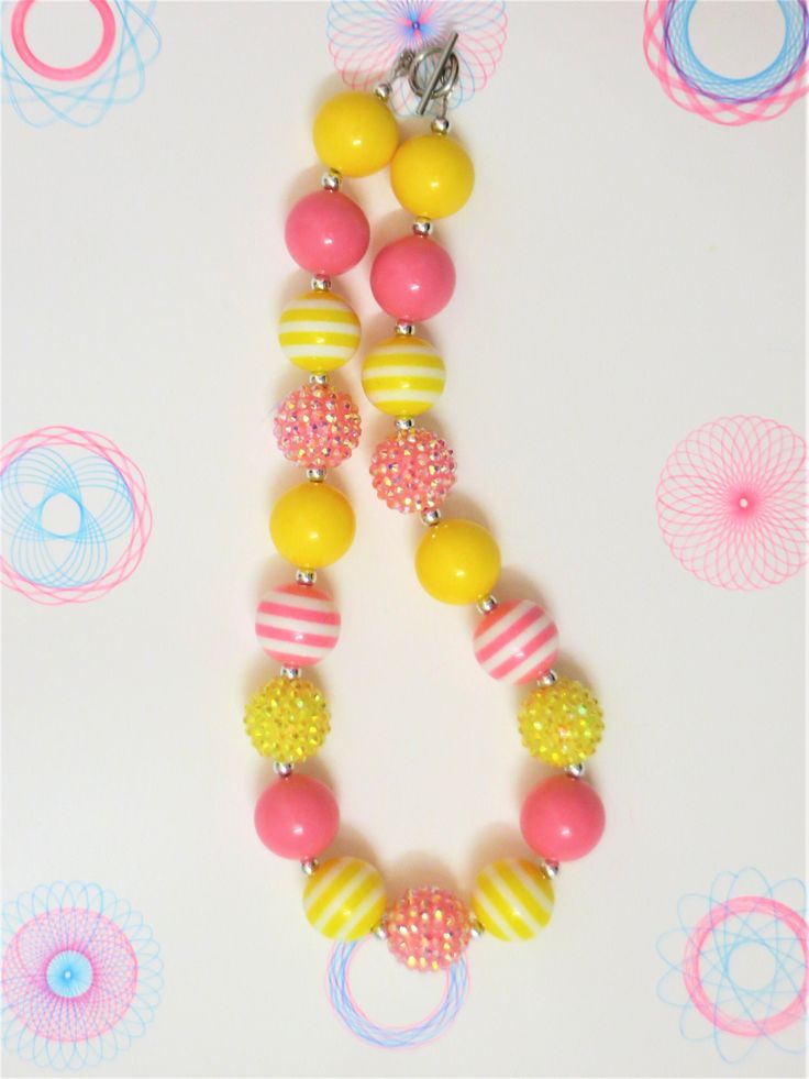 "-  Pink, and yellow chunky beads with silver spacer and sparkle beads -  Your little girl or toddler will look like a Princess in this beautiful, fun, Chunky Bubblegum Necklace. -  This necklace would be the perfect dazzling addition for your little Princess outfit to wear for any special occasion. -  Necklace length 17\"  Materials:  acrylic beads, resin beads, bead wire, crimp tubes, jump rings, stainless steel clasps **Custom Orders Are Welcome** Ready to ship in 1 to 3 business days by USPS First Class Mail. - Returns & Exchanges I do accept returns and exchanges.  Just mail it back to me within 7 days of delivery. WARNING The jewelry is made with small beads and small parts.   Please do not leave your child unattended while wearing the jewelry.  By purchasing the jewelry you are agre Yellow Fun Jewelry With Colorful Beads, Fun Yellow Jewelry With Colorful Beads, Fun Yellow Jewelry For Birthday, Cute Yellow Jewelry With Colorful Beads, Fun Yellow Round Beaded Jewelry, Fun Yellow Round Beads Jewelry, Cute Yellow Round Bead Necklaces, Cute Adjustable Yellow Necklace, Cute Adjustable Yellow Necklaces