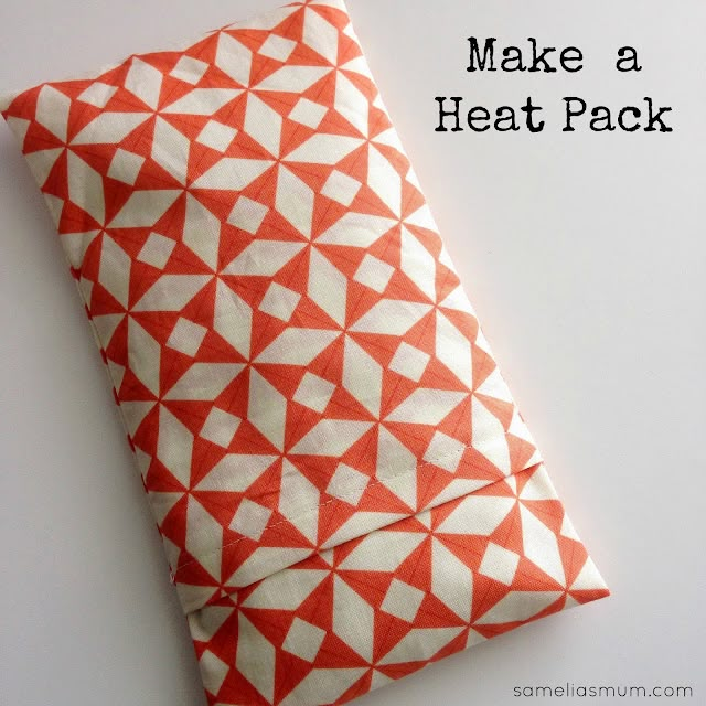 an orange and white pillow with the words make a heat pack on it's side