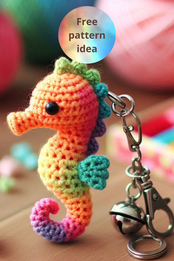 a crocheted seahorse keychain with a free pattern on the side