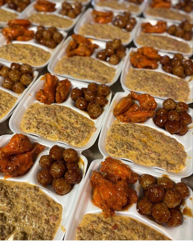 several trays filled with different types of food