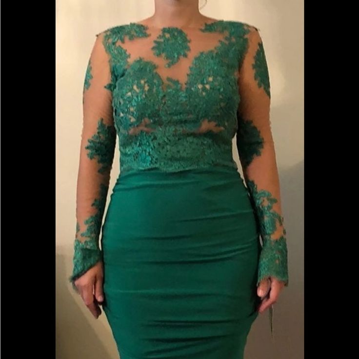 Stunning Beautiful Long Sleeve Green Evening Gown. Featuring A Lace Top, Fitted Body Con Bottom And Open Back. Was Never Worn - Brand New. Size 10 Fitted Green Dress With Lace Bodice, Long Sleeve Dress With Lace Bodice For Gala, Fitted Long Sleeve Evening Dress With Lace Bodice, Fitted Gown With Lace Sleeves For Prom Season, Fitted Gown With Lace Sleeves For Prom, Elegant Fitted Green Lace Dress, Fitted Mother Of The Bride Dress With Lace Sleeves, Green Dress With Lace Bodice And Fitted Bodice, Green Dress With Lace Fitted Bodice