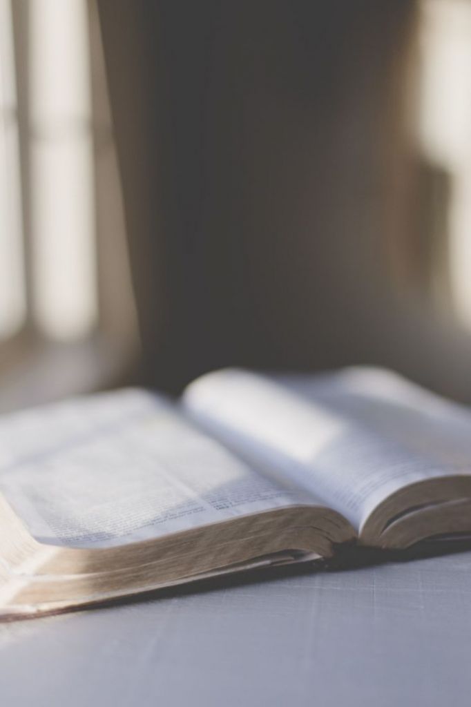 an open book sitting on top of a table