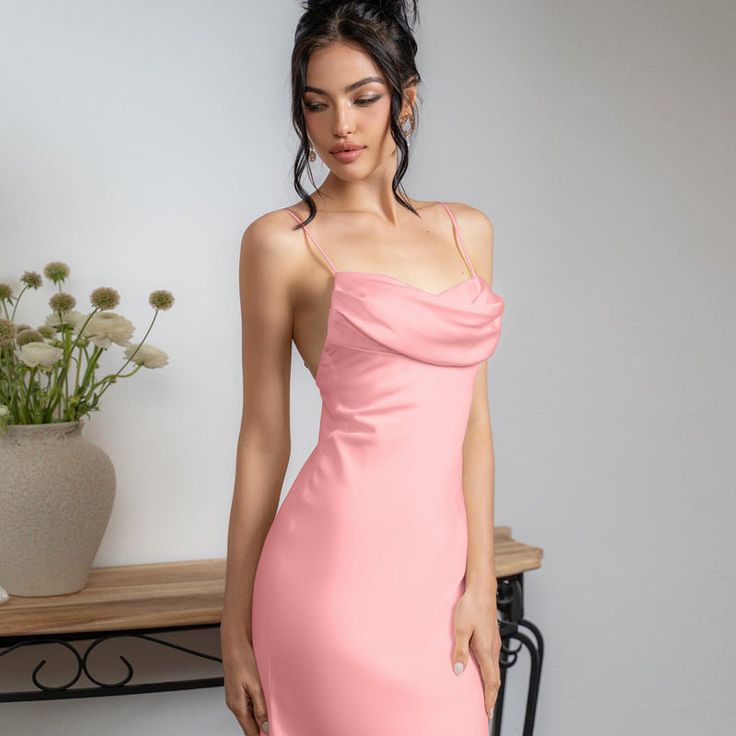 Features: Introducing our Spaghetti Satin Long Dress for women - the perfect addition to your wardrobe. This backless, pleated dress features a sexy high waist design and a halter neckline, making it the ideal choice for any elegant party look. Made with high-quality satin material, this dress is both comfortable and stylish. Elevate your fashion game with this must-have piece. Backless Midi Dress With Built-in Bra For Date Night, Elegant Backless Midi Dress With Built-in Bra, Elegant Backless Slip Dress With Ruched Bodice, Backless Cocktail Midi Dress With Ruched Back, Backless Midi Dress With Ruched Back For Cocktail, Backless Midi Dress With Ruched Back For Night Out, Backless Party Midi Dress With Built-in Bra, Elegant Suspender Dress With Built-in Bra, Backless Cocktail Midi Dress With Ruched Bodice