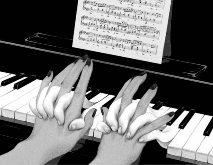 two hands on the keys of a piano with sheet music in the backgroun