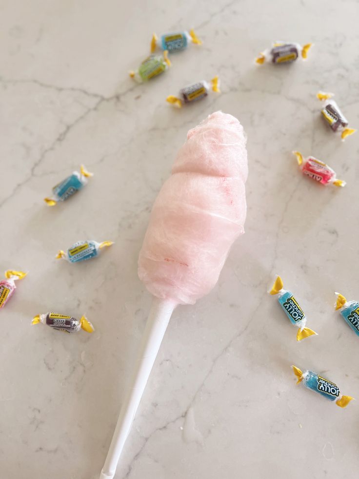 Cotton candy on a counter surrounded by jolly rancher candies. Jolly Rancher Cotton Candy Microwave, Jolly Rancher Marshmallows, Easy Cotton Candy Recipe, Cotton Candy Sugar Recipe, Jolly Rancher Cotton Candy, Homemade Cotton Candy Sugar, Diy Cotton Candy Sugar, Cotton Candy Party Ideas, Cotton Candy Recipes