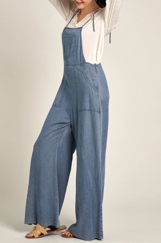 tie strap denim jumpsuitpockets, side zipper content & care 100% tencel hand wash cold, line dry, low iron if needed Stylish Overalls, Vintage Slip Dress, Denim Wide Leg, Cardigan Outfits, Crop Top Blouse, Denim Jumpsuit, Low Iron, Wide Leg Denim, Wide Leg Jumpsuit