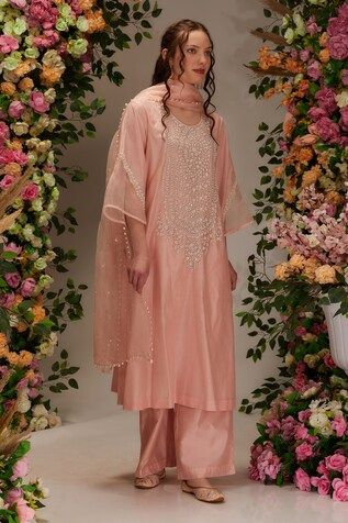 Peach kurta featuring sequin and moti embellishment in floral pattern. Paired with a pant and a moti embellished sheer dupatta. - Aza Fashions Spring Festive Sharara With Gota Work, Spring Wedding Kurta With Mirror Work, Spring Wedding Set With Gota Work, Spring Wedding Sets With Gota Work, Spring Chanderi Anarkali Set With Mirror Work, Spring Festive Salwar Kameez With Mirror Work, Spring Traditional Wear With Mirror Work, Semi-stitched, Spring Reception Palazzo Set With Dupatta, Spring Wedding Palazzo Set With Mirror Work