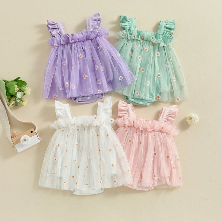 Give your little girl a stylish and comfortable look with this charming romper dress made with tulle and beautiful daisy embroidery. Available in four colors, it's the perfect choice for any occasion. Playful Tulle Tutu Dress For Summer, Summer Tulle Tutu Dress, Summer Tulle Dress With Floral Applique, Sweet Summer Tutu Dress, Sweet Tulle Summer Dress, Sweet Summer Tulle Dress, Sweet Summer Dresses With Floral Applique, Cute Floral Applique Tutu Dress For Spring, Cute Spring Tutu Dress With Floral Applique