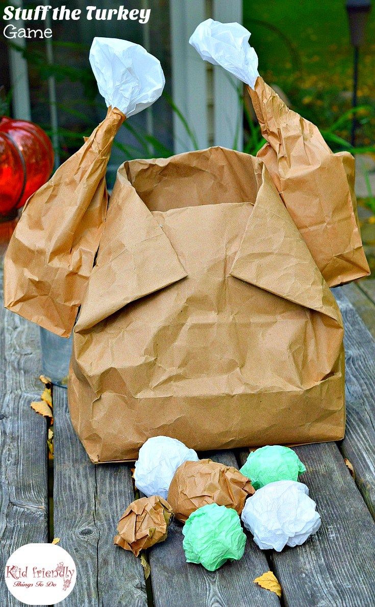 a brown paper bag sitting on top of a wooden table