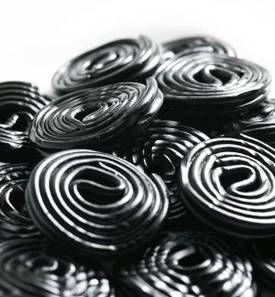 a pile of black and white spirals sitting on top of each other in front of a white background