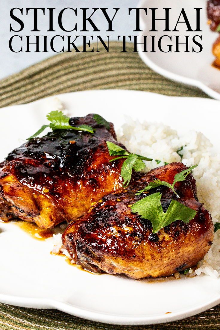 sticky thai chicken thighs with white rice on a plate