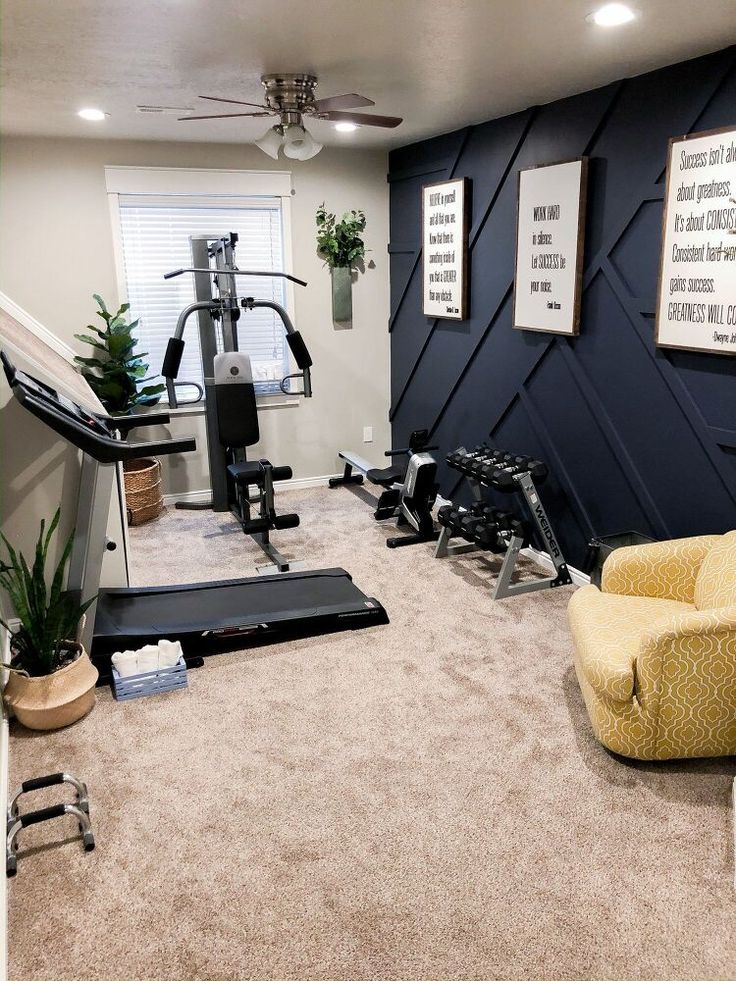 a home gym with an exercise bike, treadmills and other equipment in the room