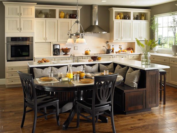 a kitchen filled with lots of counter top space next to a dining room table and chairs