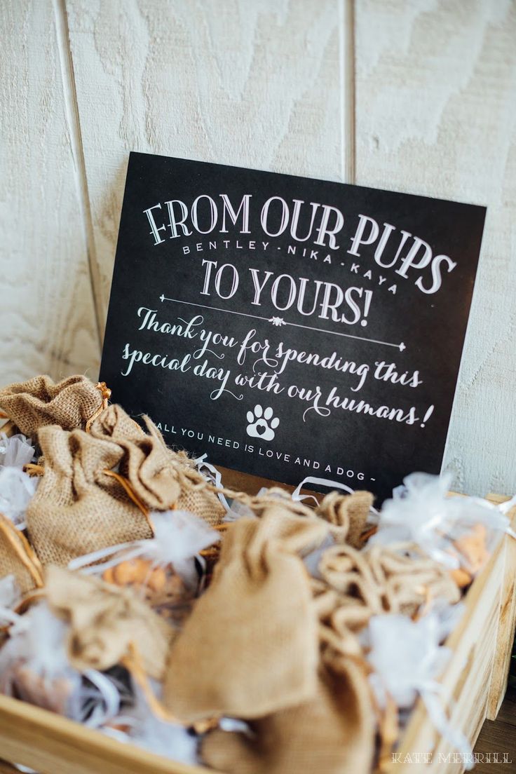 a basket filled with lots of stuff next to a sign that says from our pups to yours