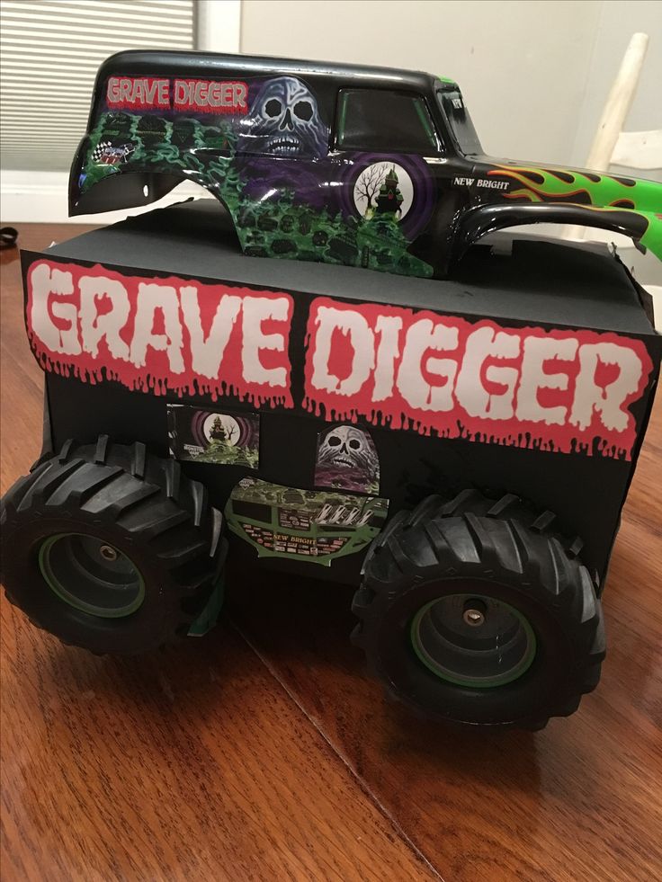 a monster truck made out of cardboard with grave digger on it's front wheels