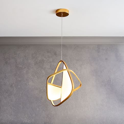 a light fixture hanging from the ceiling in a room with concrete walls and flooring