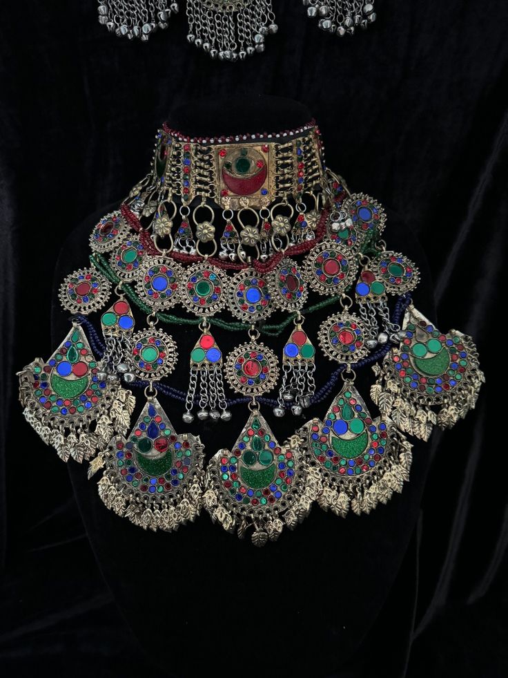 Exquisite Afghan Jewelry Set - Perfect for Special Occasions🇦🇫 Add a touch of exotic elegance to your look with our stunning Afghan jewelry set. Handcrafted by skilled artisans, each piece is a unique work of art that captures the rich cultural heritage of Afghanistan. This set includes a dazzling necklace, matching earrings, and a Tikka headpiece, all intricately designed with traditional Afghan motifs and embellished with vibrant Multicoloured gemstones. Balochi Doch Jewelry, Traditional Beaded Festival Jewelry, Multicolor Bohemian Jewelry With Intricate Design, Traditional Jewelry For Festivals, Bohemian Heavy Ceremonial Jewelry, Ceremonial Multicolor Necklace With Intricate Design, Adjustable Multicolor Ceremonial Jewelry, Multicolor Necklace With Intricate Design For Ceremonial Occasions, Heavy Multicolor Jewelry For Ceremonial Occasions