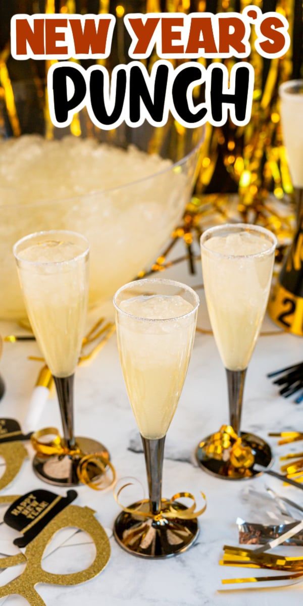 new year's punch in champagne glasses on a table with gold confetti