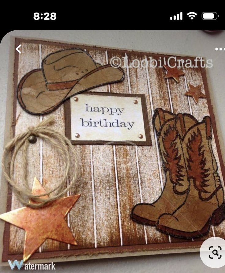 a birthday card with cowboy boots and a happy birthday tag hanging from the front of it