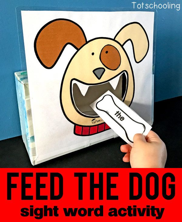 a hand holding a white toothbrush in front of a book with the title feed the dog sight word activity