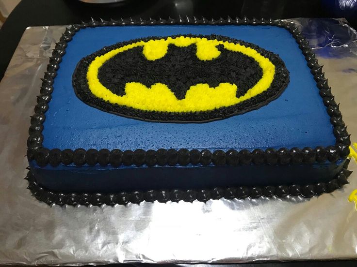 a batman themed cake on top of a table