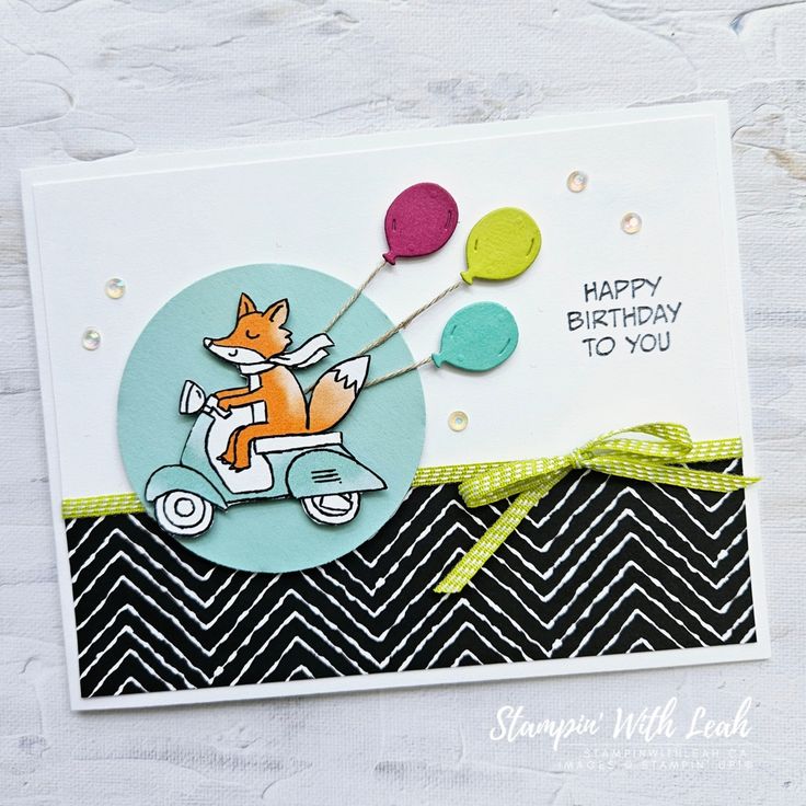 a birthday card with a fox on a scooter