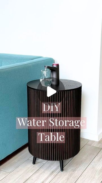 a black table with a glass on top and the words diy water storage table above it