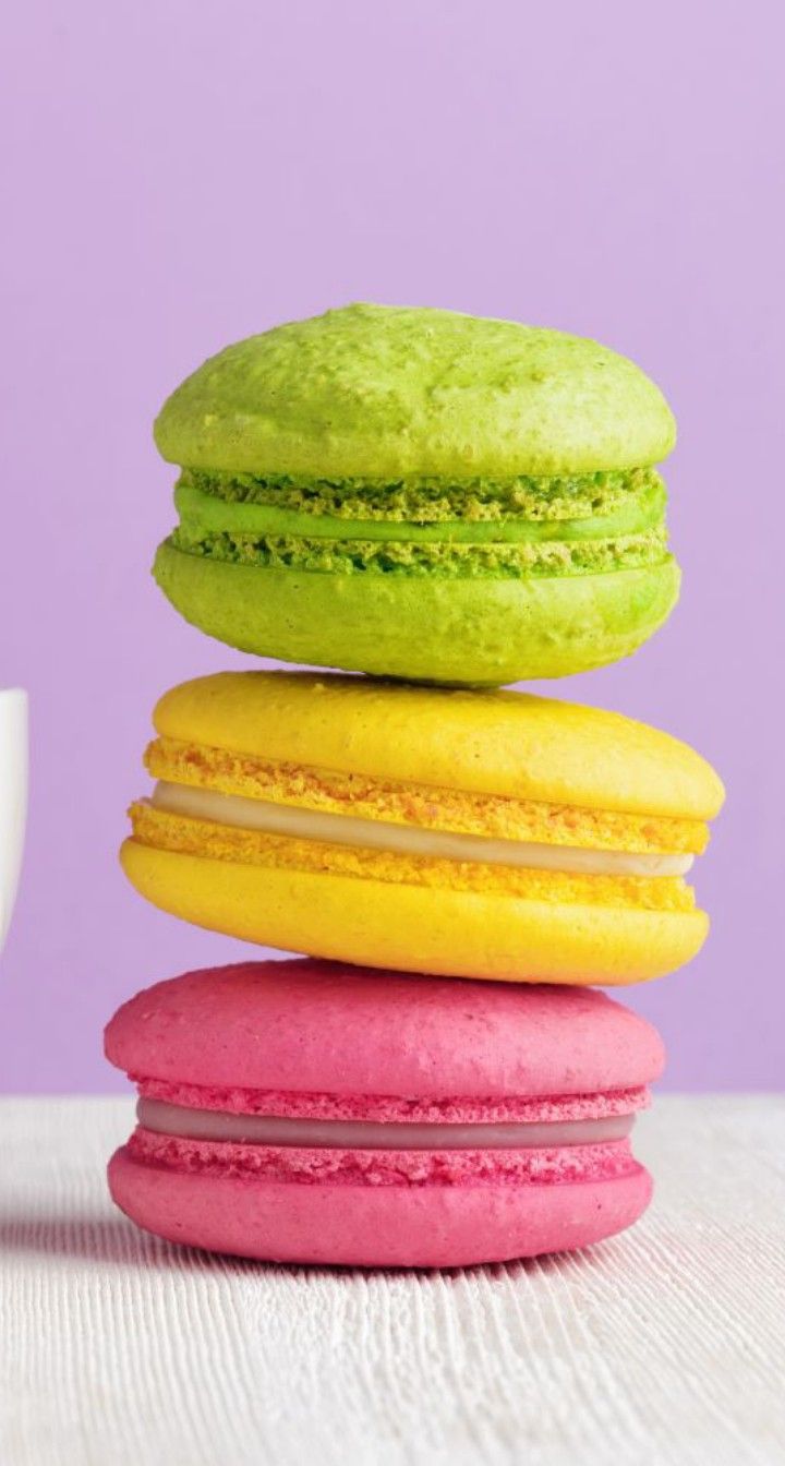 a stack of colorful macaroons sitting on top of each other