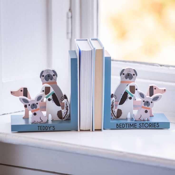 two bookends made to look like koala bears sitting next to each other