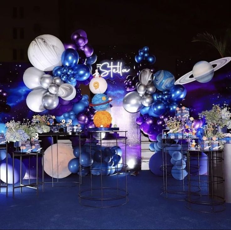 an event with balloons and space themed decorations